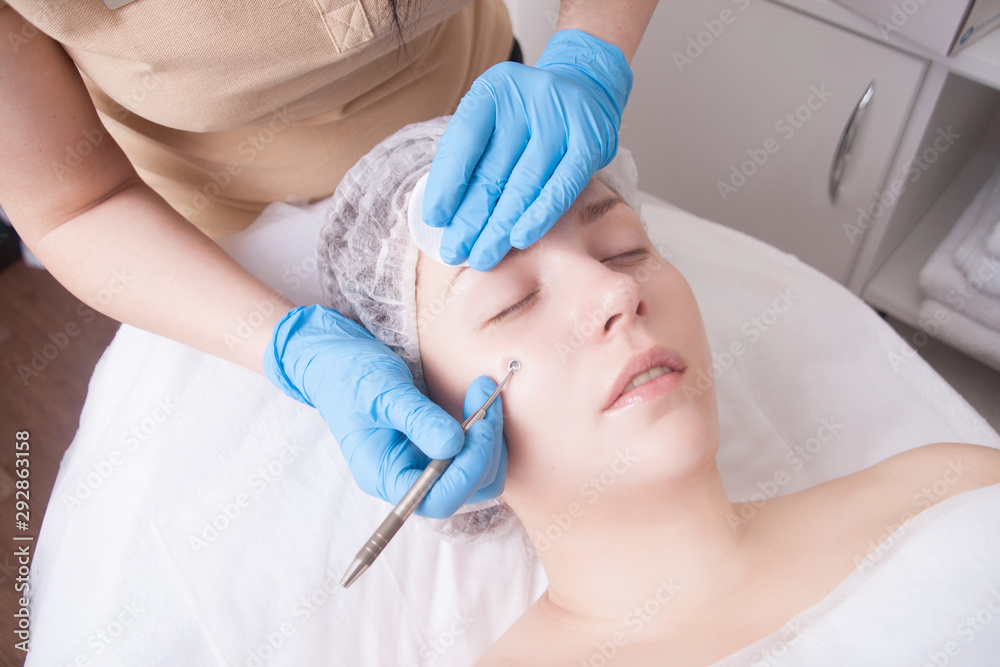 Manual face cleansing from blackheads at a beautician in a beauty salon. Care for problem skin. Manual face cleansing from blackheads at a beautician in a beauty salon. Care for problem skin.