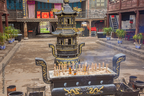 Censer in the courtyard of the City God Temple in the old town of Pingyao photo