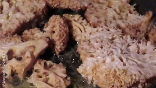 cauliflower fungus (Sparassis crispa). roast mushroom in pan with butter. photo