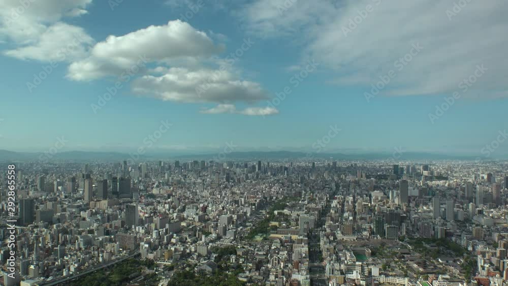 OSAKA, JAPAN - CIRCA SEPTEMBER 2019 : Aerial high angle view of CITYSCAPE of OSAKA in daytime. Osaka is the capital city of Osaka Prefecture and the second largest metropolitan area in Japan. OSAKA, JAPAN - CIRCA SEPTEMBER 2019 : Aerial high angle view of CITYSCAPE of OSAKA in daytime. Osaka is the capital city of Osaka Prefecture and the second largest metropolitan area in Japan.