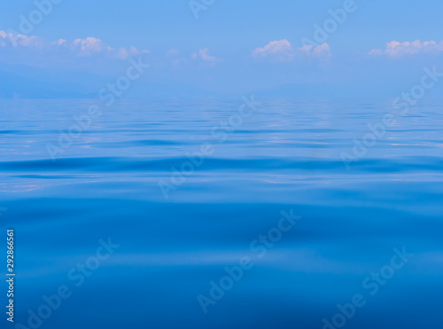 Calm clear blue water and waves background. Ohrid lake, Macedonia
