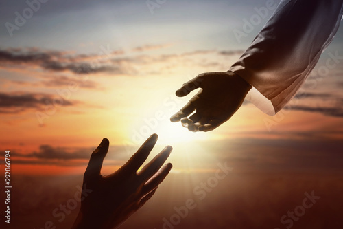 Jesus Christ giving a helping hand to human photo