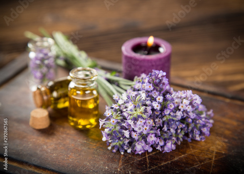 Wellness treatments with lavender flowers on wooden table. Spa still-life.