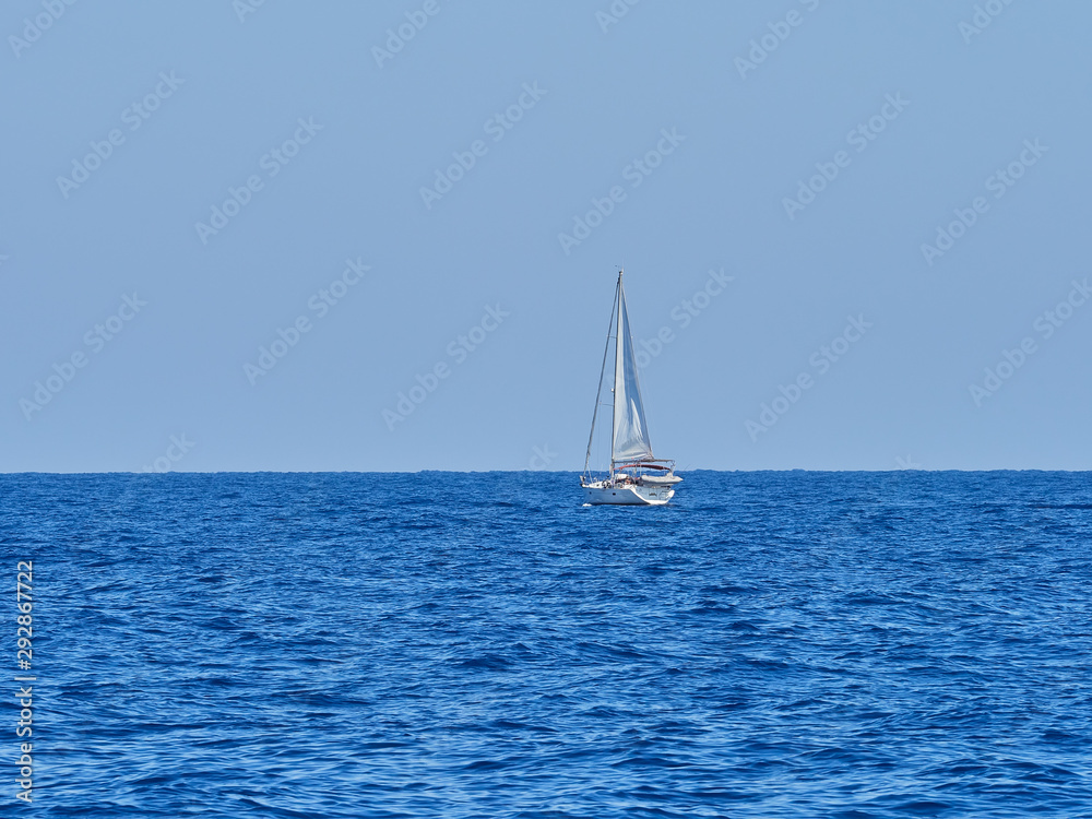 Sailing boat at an open sea, Greece