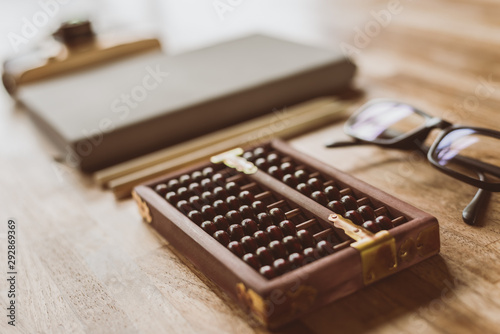 abacus and books on a table at home