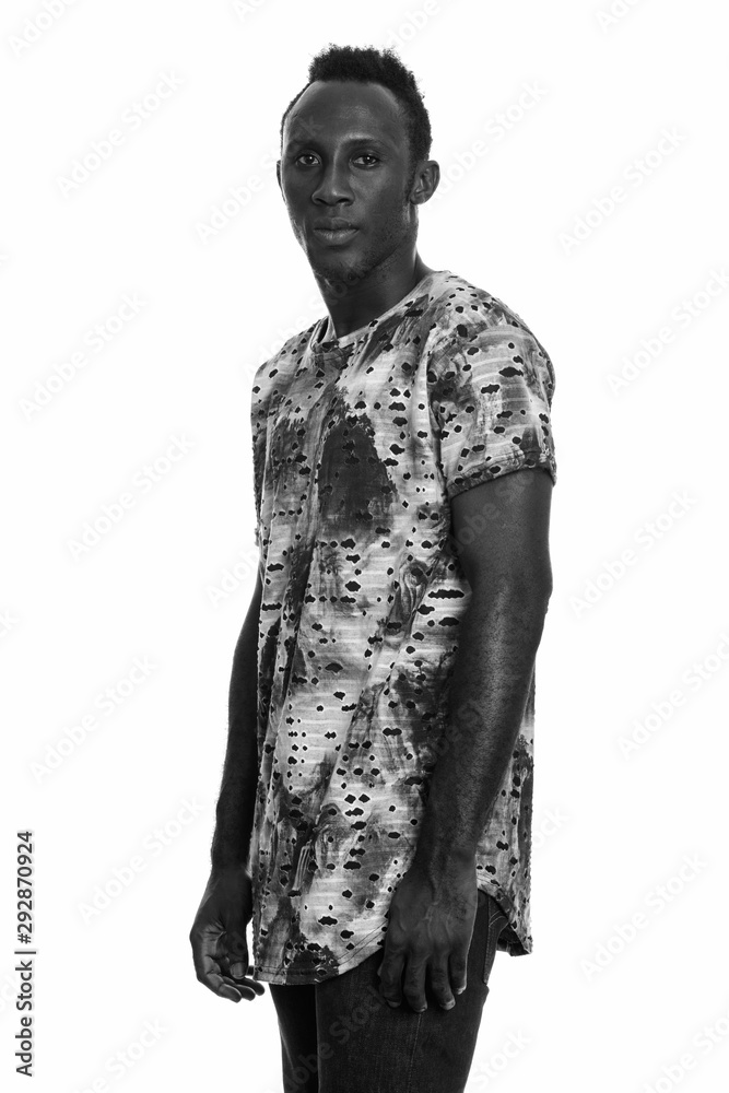 Studio shot of young African man in black and white