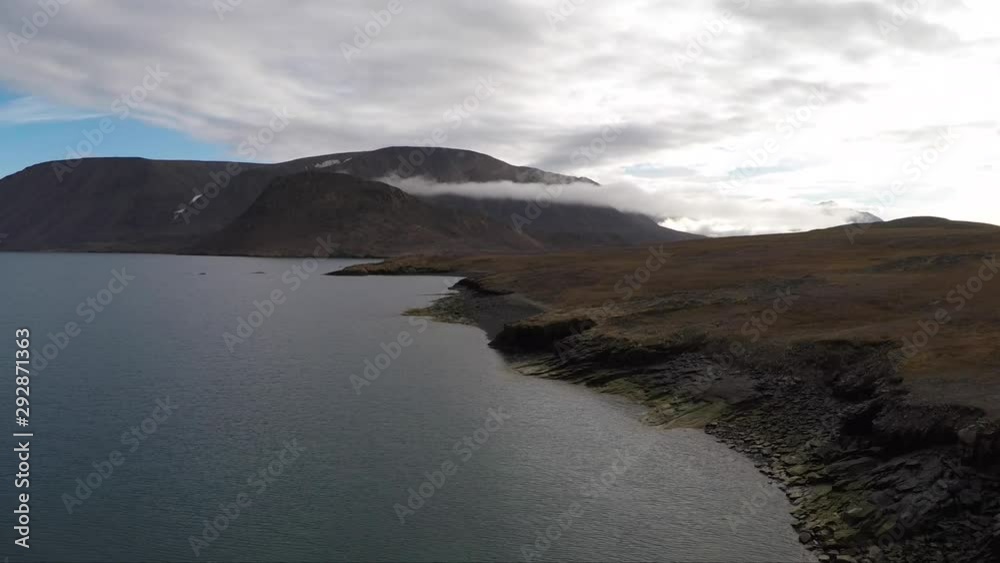 4K High Quality travel inspired series - slow motion drone footage in the Arctic Ocean. Sea Ships, research vessles, ice burgs, glaciers, ocean, zodiacs, moody and beautiful.