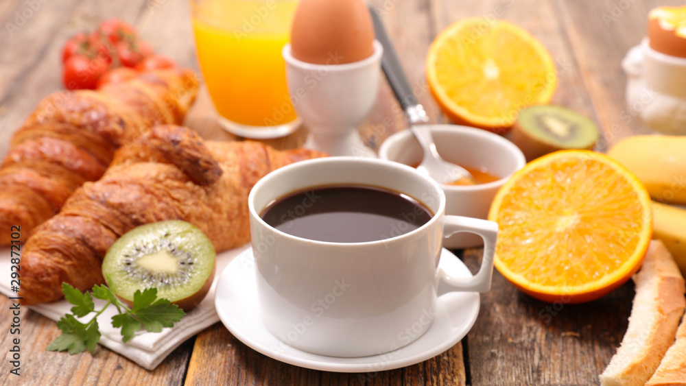 continental breakfast, coffee cup, croissant, egg and orange juice