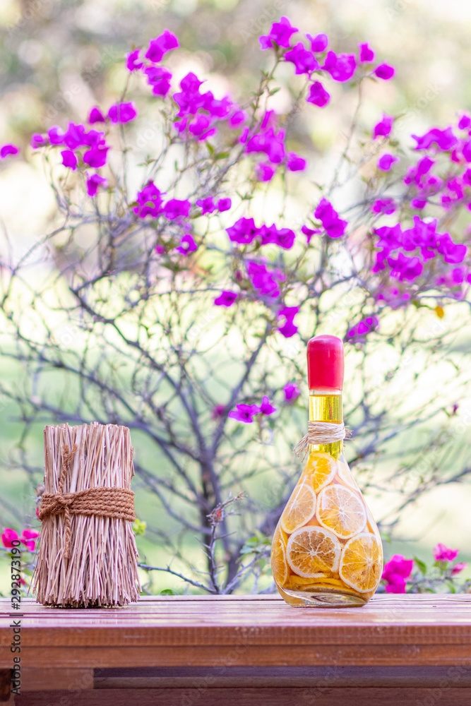 Pickled orange slices in glass bottle, on wooden table Pickled orange slices in glass bottle, on wooden table