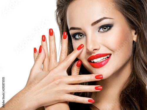 Photography beautiful smiling woman with red nails