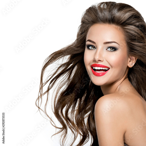 Beautiful happy laughing woman with long brown hair