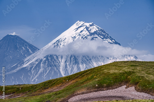 view on Kamen Volcano, active Klyuchevskoy Volcano and active Bezymianny Volcano. © filin174