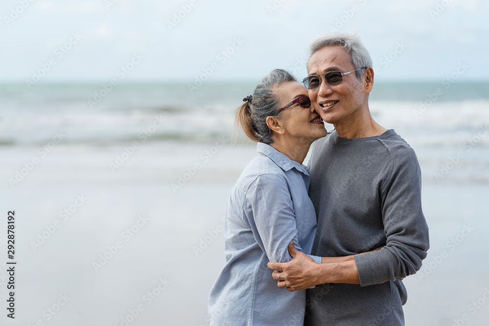 Asian couple senior elder retire resting relax walking running at the beach.Honeymoon family together happiness people lifestyle.Mature couples relax at the seaside on holiday.