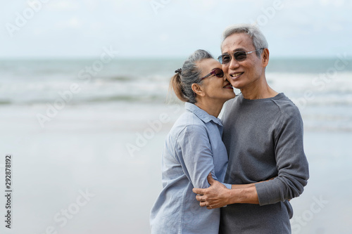 Asian couple senior elder retire resting relax walking running at the beach.Honeymoon family together happiness people lifestyle.Mature couples relax at the seaside on holiday. © pic for you