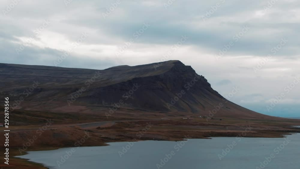Aerial panning view of a fjord and a red volcanic beach in West Iceland Aerial panning view of a fjord and a red volcanic beach in West Iceland
