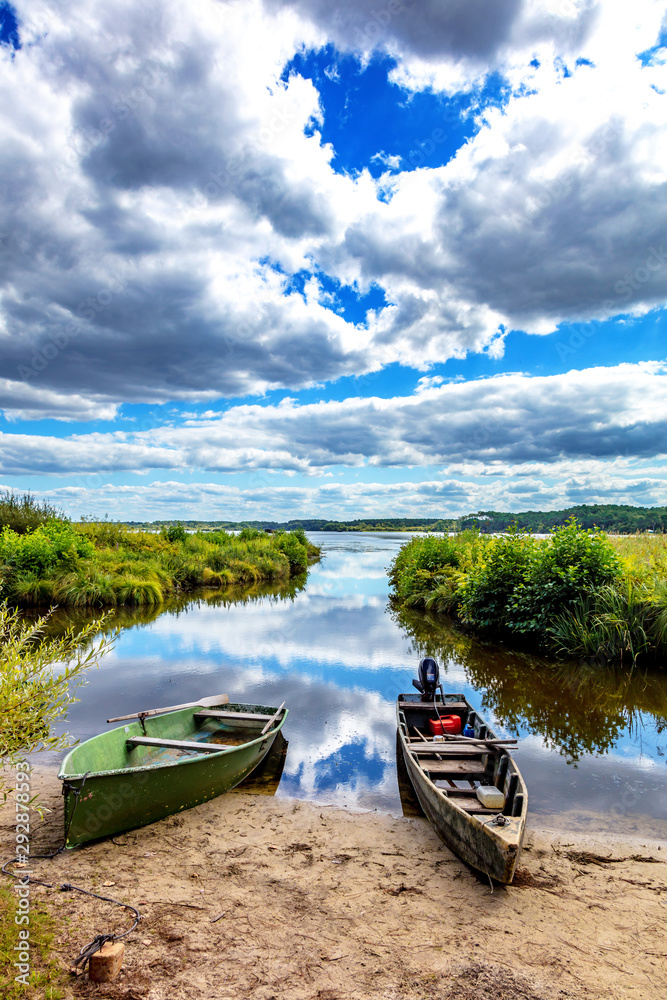 Seignosse, Landes, France - View of boats in front of Hardy Pond Seignosse, Landes, France - View of boats in front of Hardy Pond
