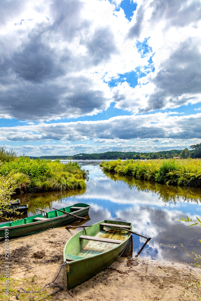 Seignosse, Landes, France - View of boats in front of Hardy Pond Seignosse, Landes, France - View of boats in front of Hardy Pond