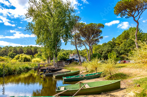 Seignosse, Landes, France - View of boats in front of Hardy Pond photo