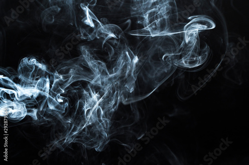 Photo of a wisp of smoke on a dark background