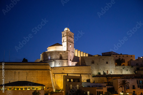 Walking in Ibiza's medieval age old town and fortress Dalt Vila, in Ibiza Town: the cathedral and castle and the magic of the night lights