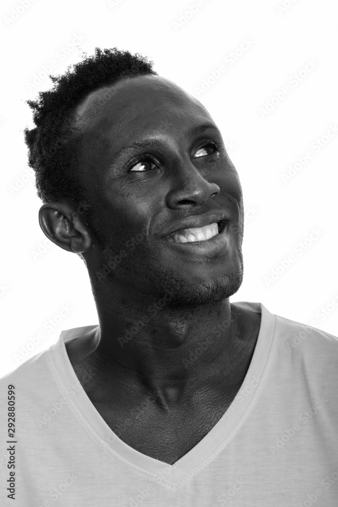 Face of young happy African man smiling and thinking Face of young happy African man smiling and thinking