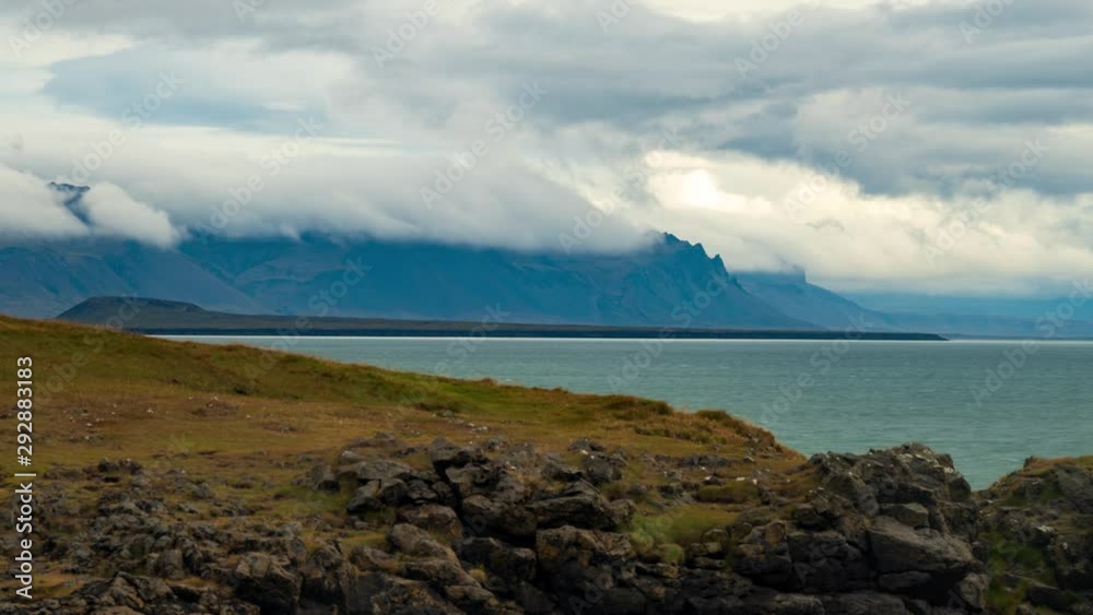 Time lapse view of clouds on volcanic mountains in a fiord in West Iceland Time lapse view of clouds on volcanic mountains in a fiord in West Iceland