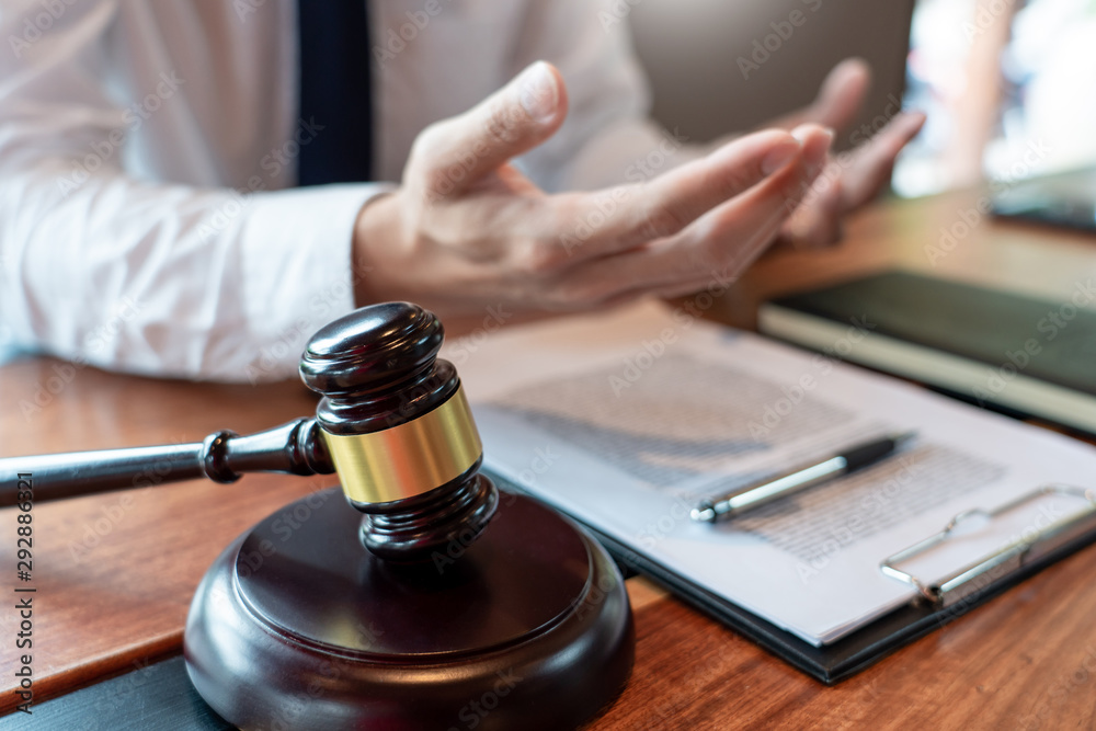 lawyer or judge business man working with paperwork agreement contract and gavel in Courtroom, Justice and Law firm Notary public concept. lawyer or judge business man working with paperwork agreement contract and gavel in Courtroom, Justice and Law firm Notary public concept.