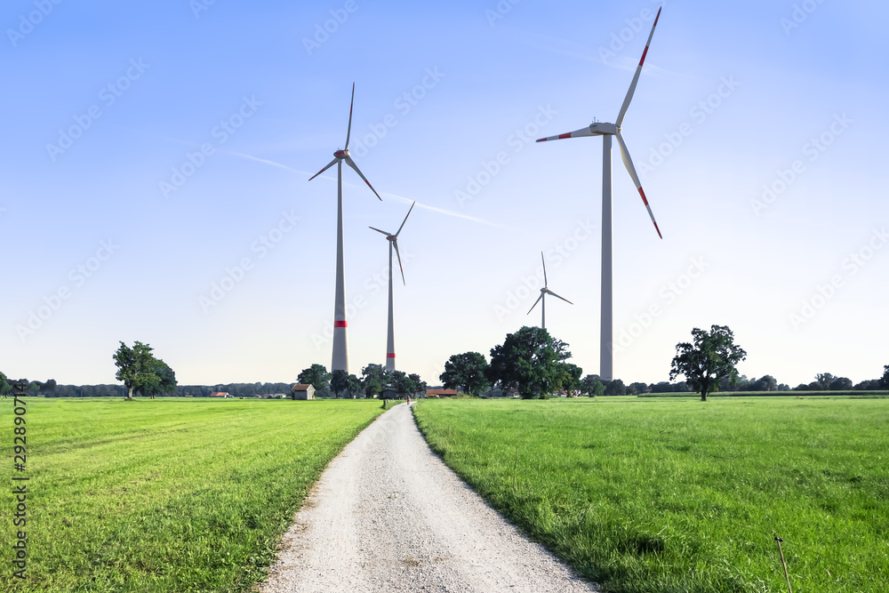 Wind Turbines on the Horizon and a Road in the Foreground Wind Turbines on the Horizon and a Road in the Foreground