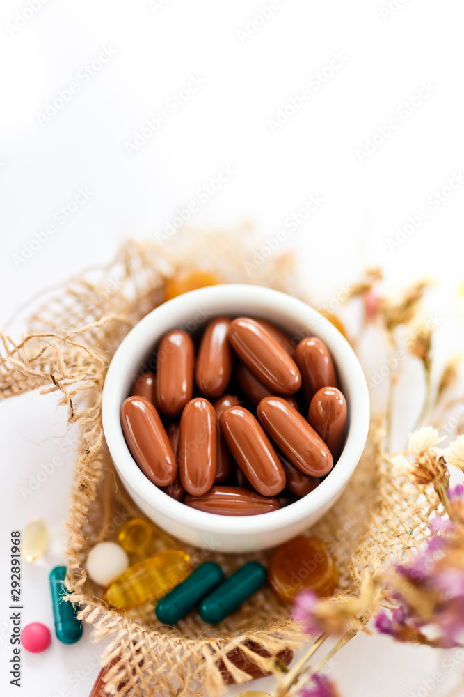 Nutritional supplements and vitamins on white background. Medicines for health support. Pills and supplements for people health. Nutritional supplements and vitamins on white background. Medicines for health support. Pills and supplements for people health.