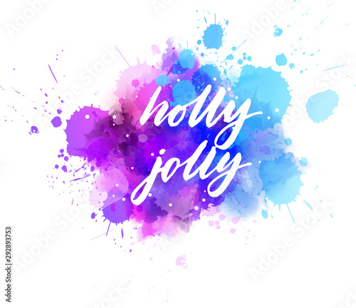 Holly jolly Christmas holiday calligraphy on watercolor paint splash
