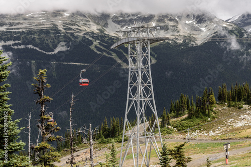 View of a cable car in Whistler, British Columbia, in the summer.  You can see the ski runs on the mountain, behind the  cable car. photo