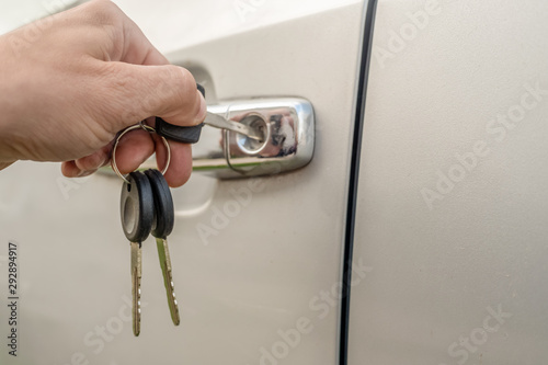 Male hand opens the car key close up