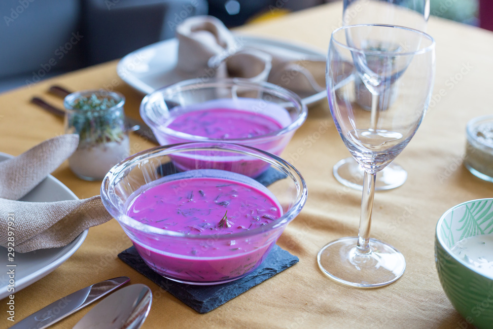Traditional Polish cold soup - chlodnik served during Easter celebration. Delicious local dish made with beetroots and buttermilk.
