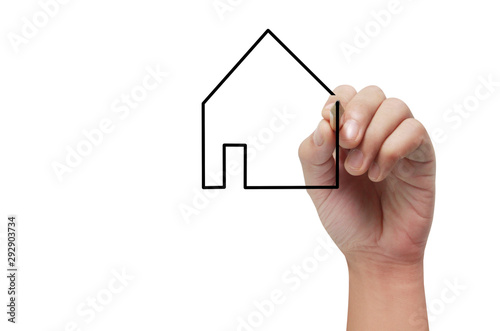 Hand holds pen  for drawing house