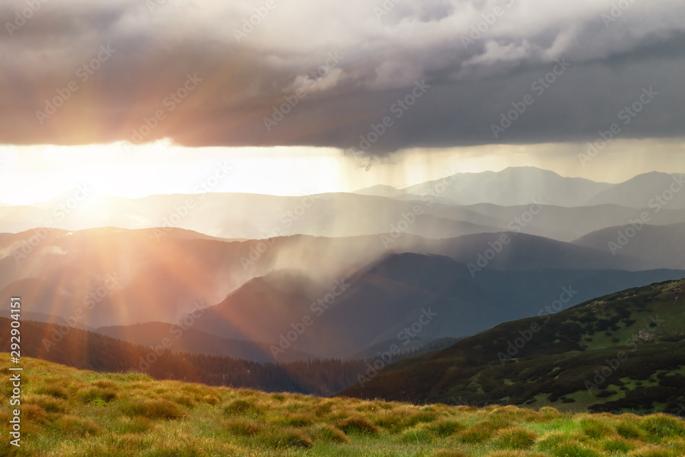 Rain and sun in the mountains. Natural phenomena
