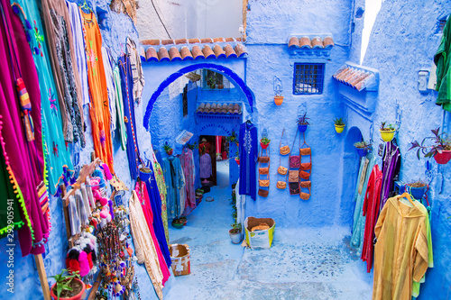 Traditional carpets on the blue Chefchaouen street.