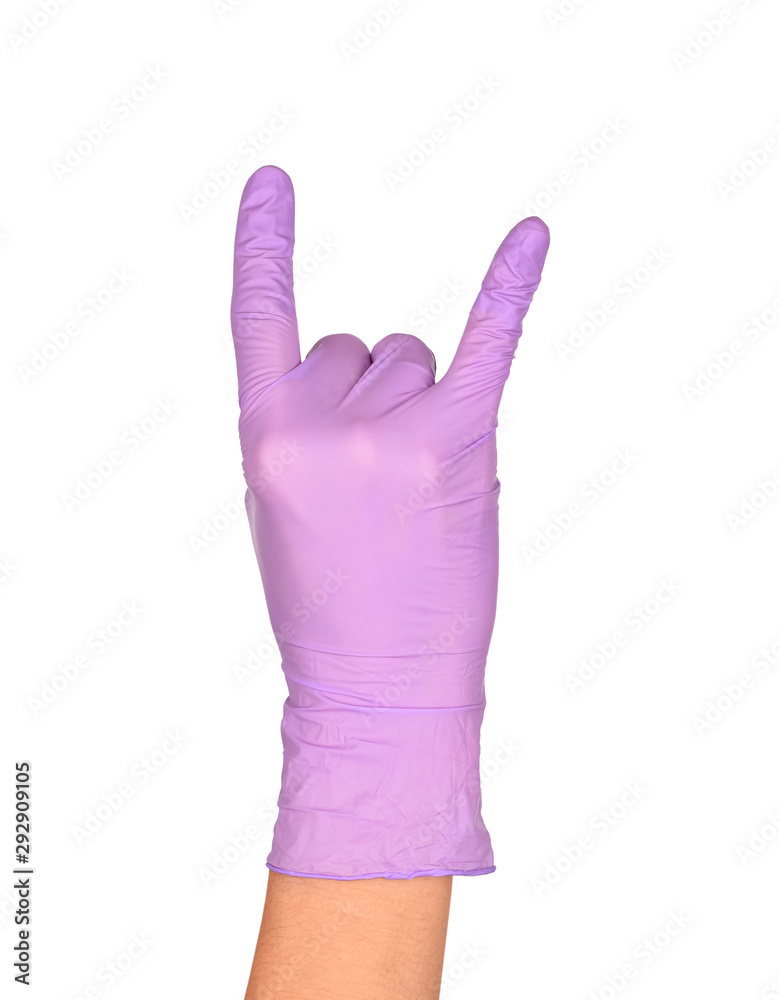 The Rock N' Roll Hand Sign. Hand in a purple latex glove isolated on white. Woman's hand gesture or sign isolated on white. The Rock N' Roll Hand Sign. Hand in a purple latex glove isolated on white. Woman's hand gesture or sign isolated on white.