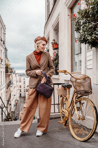 Canvas Print Outdoor full-length autumn portrait of young happy smiling fashionable lady wear