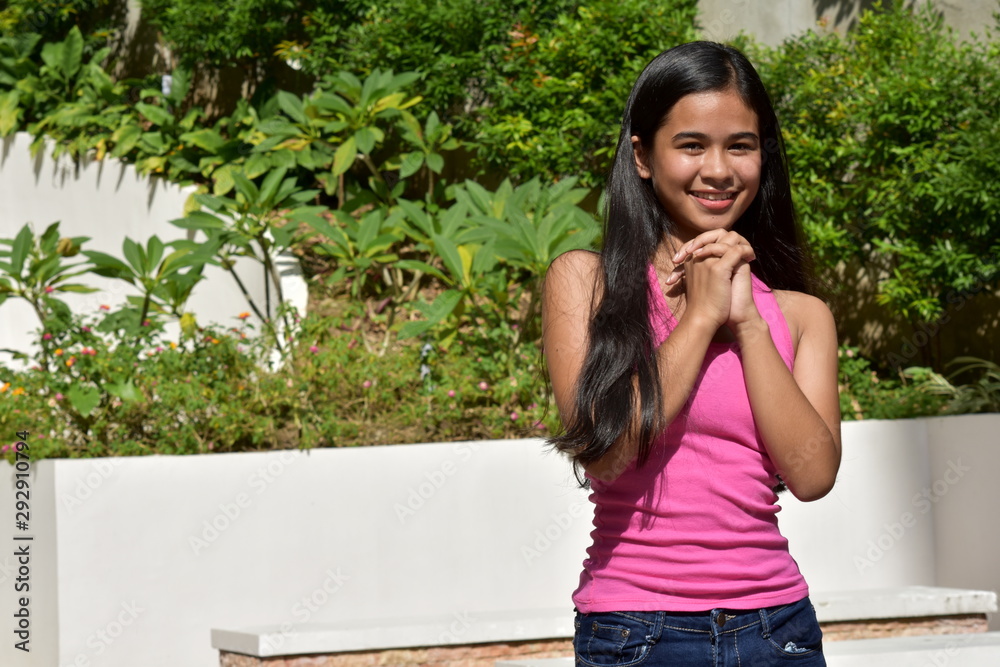 A Youthful Minority Female Youngster Praying A Youthful Minority Female Youngster Praying