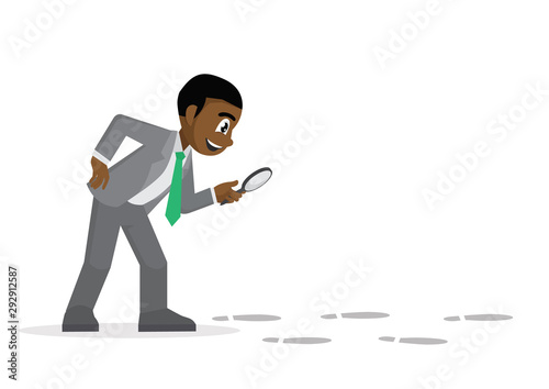  African Businessman holding a magnifying glass follow footprint.