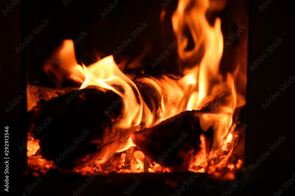 blurred burning coals in the stove blurred burning coals in the stove