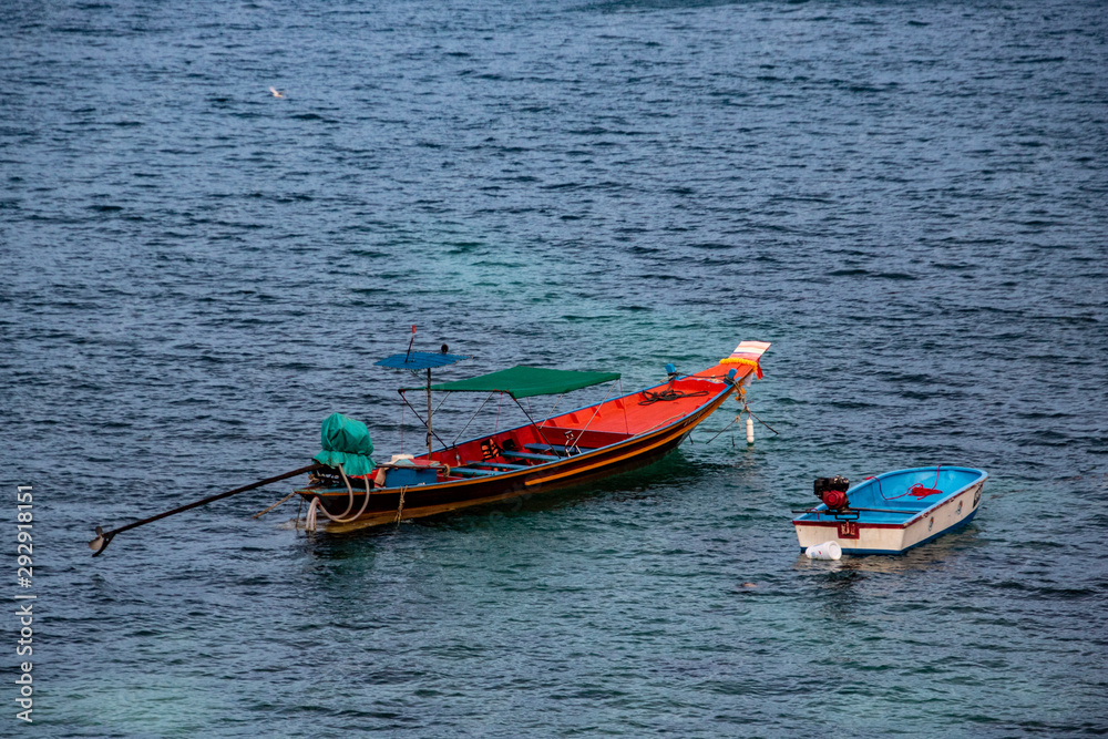 Naklejka premium Two fishing boats waiting in the bay.
