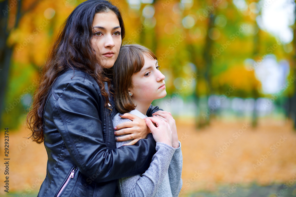 woman relaxing with autumn leaves in city park, outdoor portrait woman relaxing with autumn leaves in city park, outdoor portrait