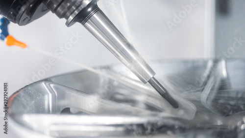 High precision CNC machining center 5 axis working, operator machining automotive sample part process in the factory