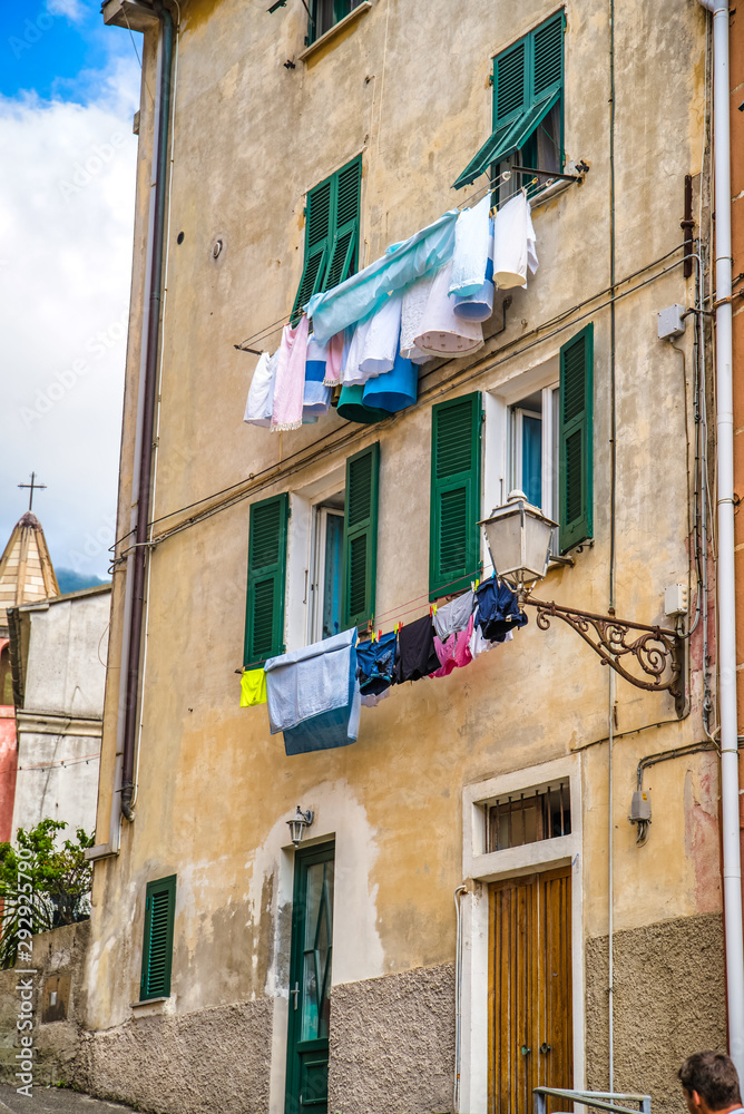Riomaggiore, Cinque Terre, Italy - August 17, 2019: City narrow streets with colorful houses, a resort town in Europe on the shore of the Ligurian Sea