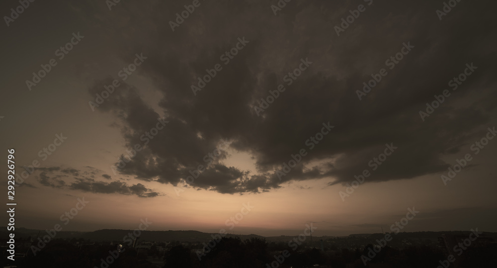 Beautiful sunset sky above clouds with dramatic light.