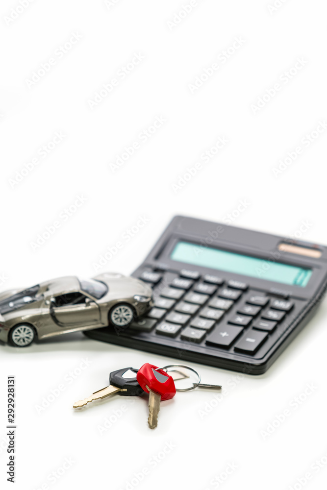 Financial Concepts of Car Loans and Credits. Composition of Scale Car and Keys against Calculator on Background. Vertical Orientation Financial Concepts of Car Loans and Credits. Composition of Scale Car and Keys against Calculator on Background. Vertical Orientation