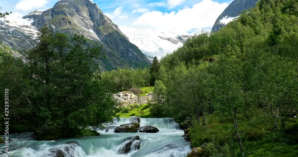 Jostedalsbreen National Park, Sogn Og Fjordane County, Norway. River Flows Near Boyabreen Glacier In Spring Sunny Day. Famous Norwegian Landmark And Popular Destination