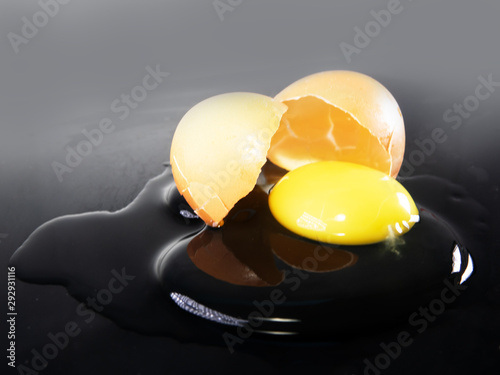 eggshell is broken and the contents of egg flowed out photo