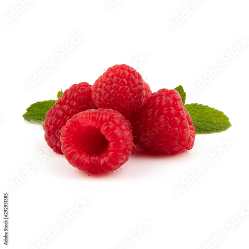 Isolated berries. Three raspberry fruits isolated on white background with green leaves